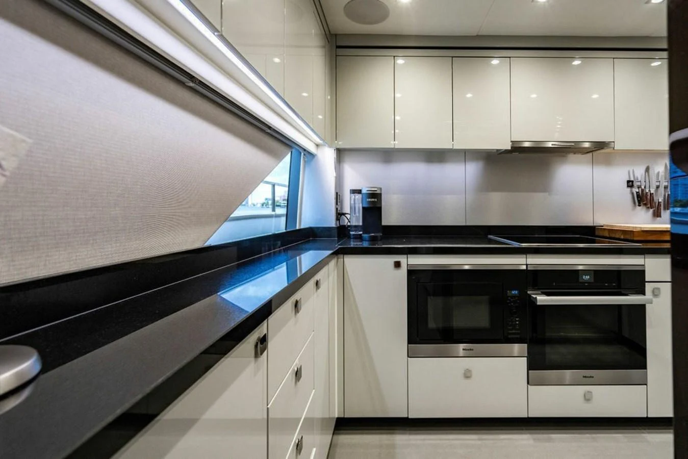 The modern galley features sleek cabinetry, high-end appliances, and ample counter space. aboard STAR OF THE SEA Yacht for Sale