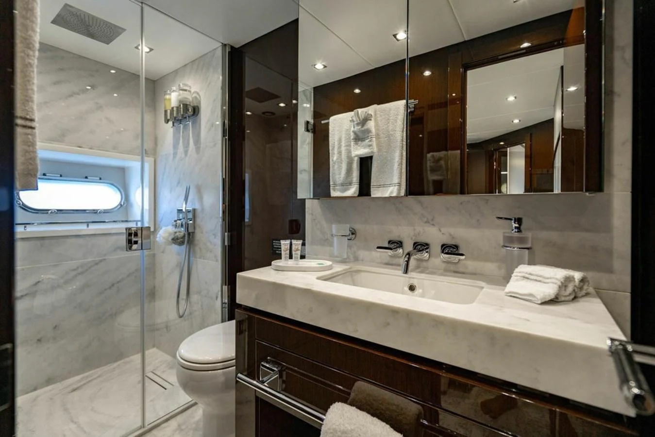 The yacht's bathroom features a sleek design with a spacious shower and elegant fixtures. aboard STAR OF THE SEA Yacht for Sale