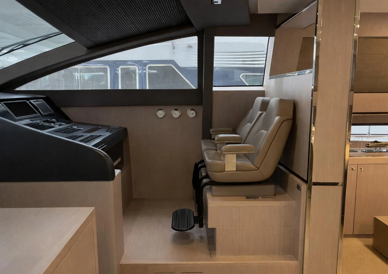 The helm station features modern controls and comfortable seating for navigation. aboard SPEEDY BEAR Yacht for Sale