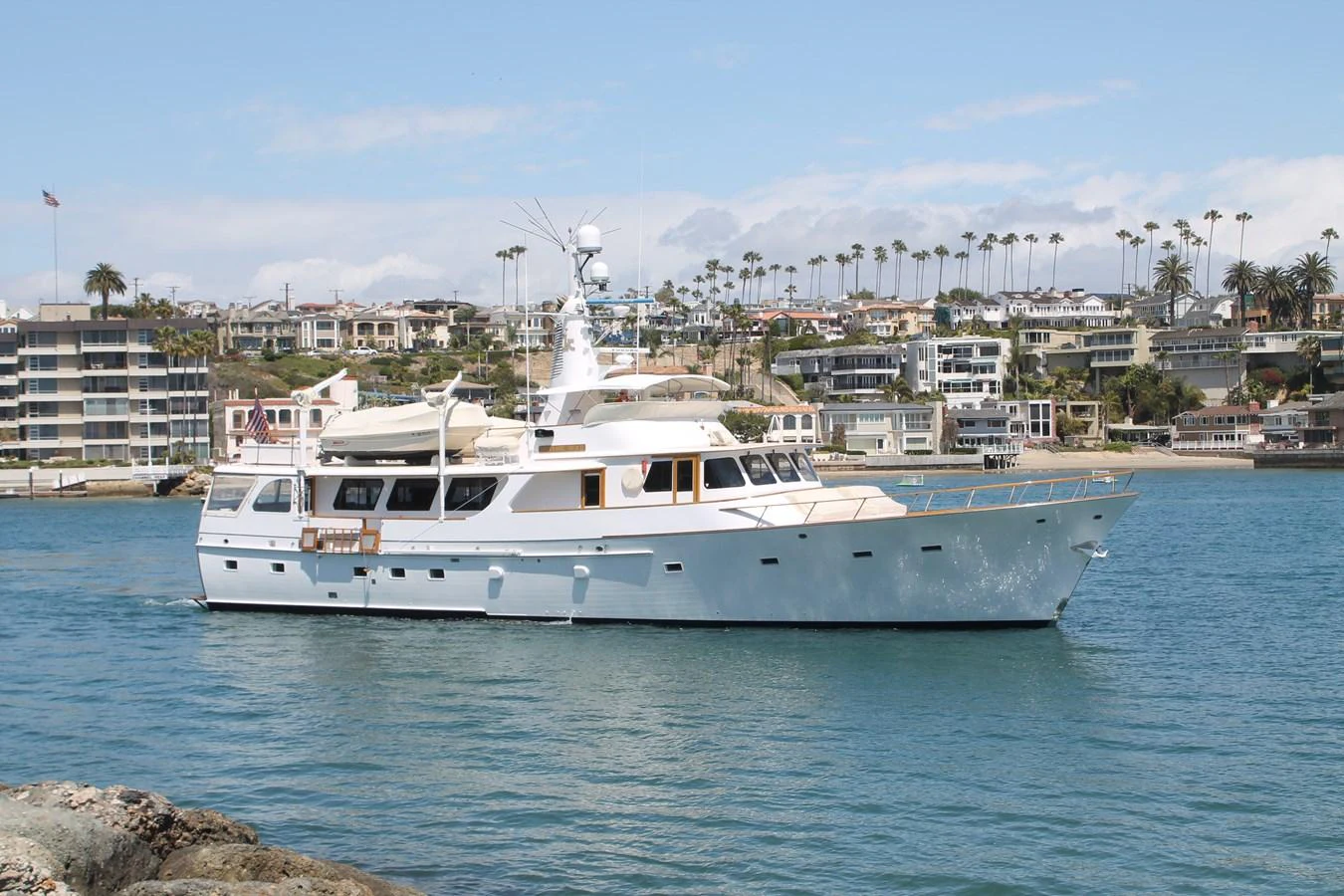 A classic yacht cruises gracefully along the coastline, showcasing its timeless design and elegance. aboard SAPPHIRE SEA II Yacht for Sale