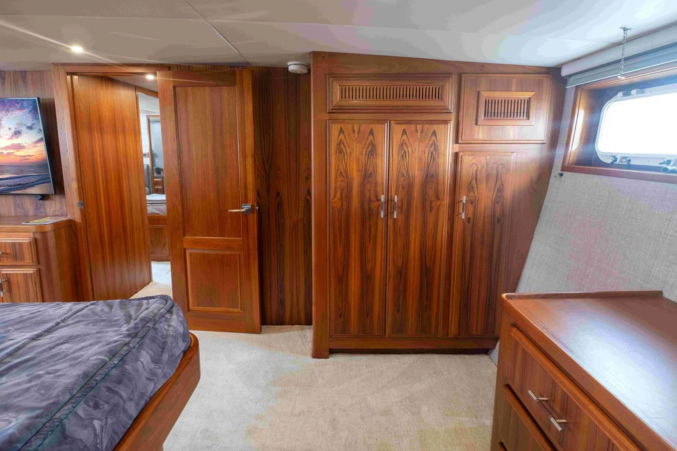 The stateroom features elegant wooden cabinetry and a cozy ambiance. aboard SAPPHIRE SEA II Yacht for Sale
