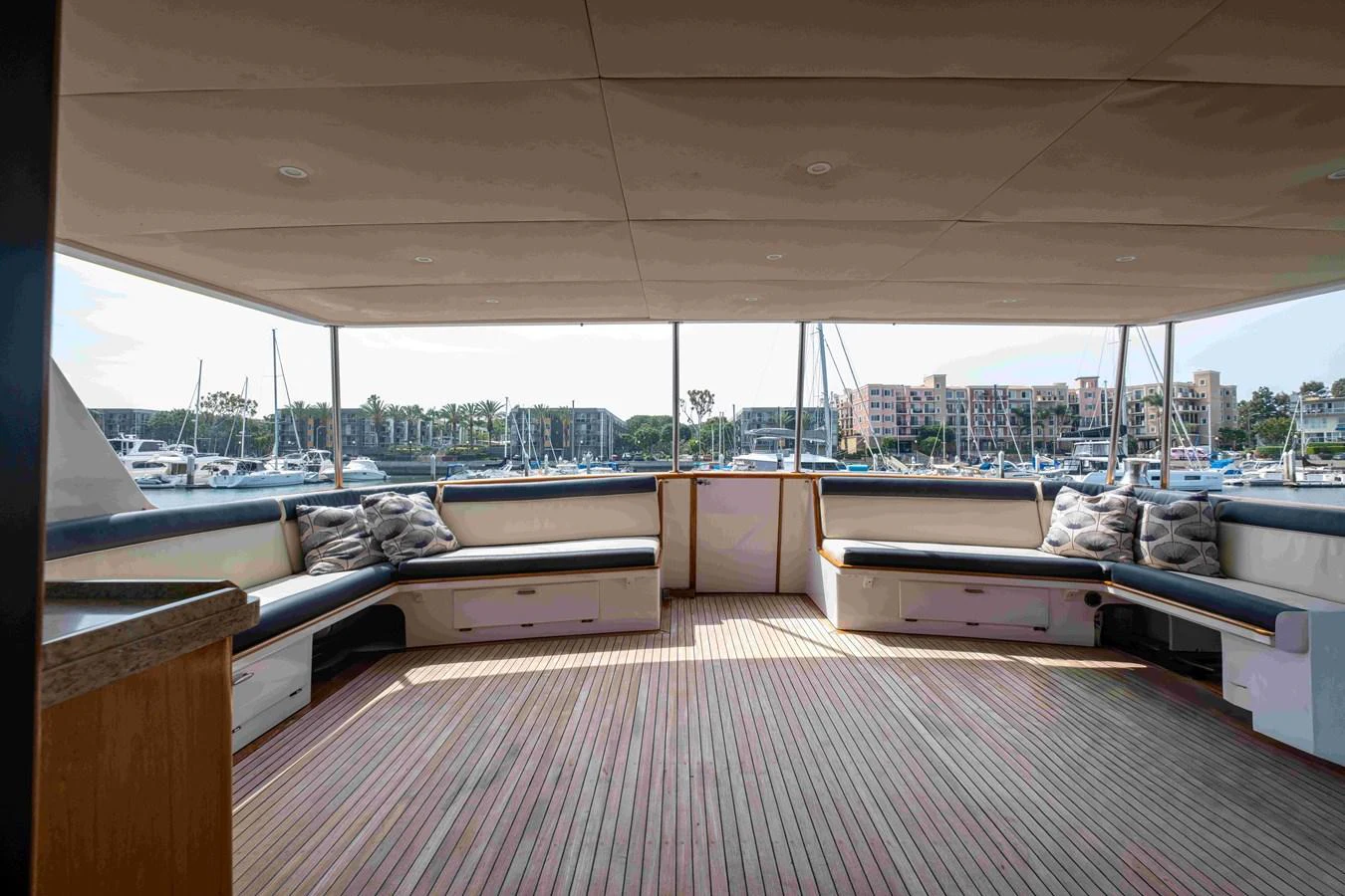 The aft deck offers a spacious and inviting area with ample seating and a panoramic view of the marina. aboard SAPPHIRE SEA II Yacht for Sale