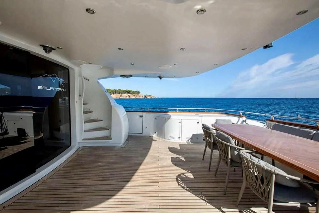 The aft deck offers a spacious area for dining and relaxation with stunning ocean views. aboard BALANDRAU Yacht for Sale