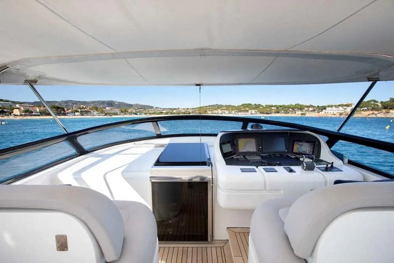 The helm offers a panoramic view with modern navigation equipment and comfortable seating. aboard BALANDRAU Yacht for Sale