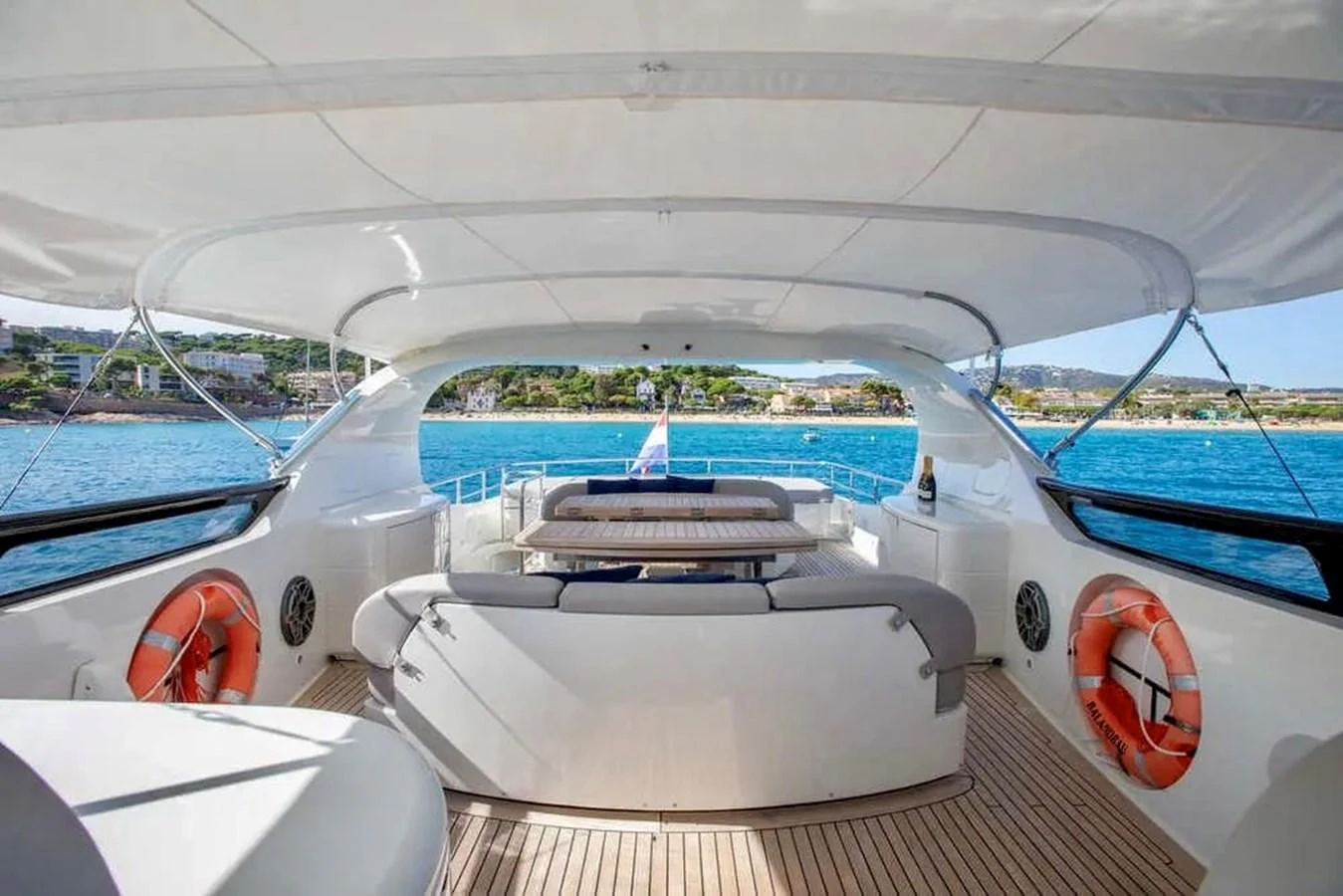 The aft deck offers a spacious seating area with stunning views of the surrounding waters. aboard BALANDRAU Yacht for Sale