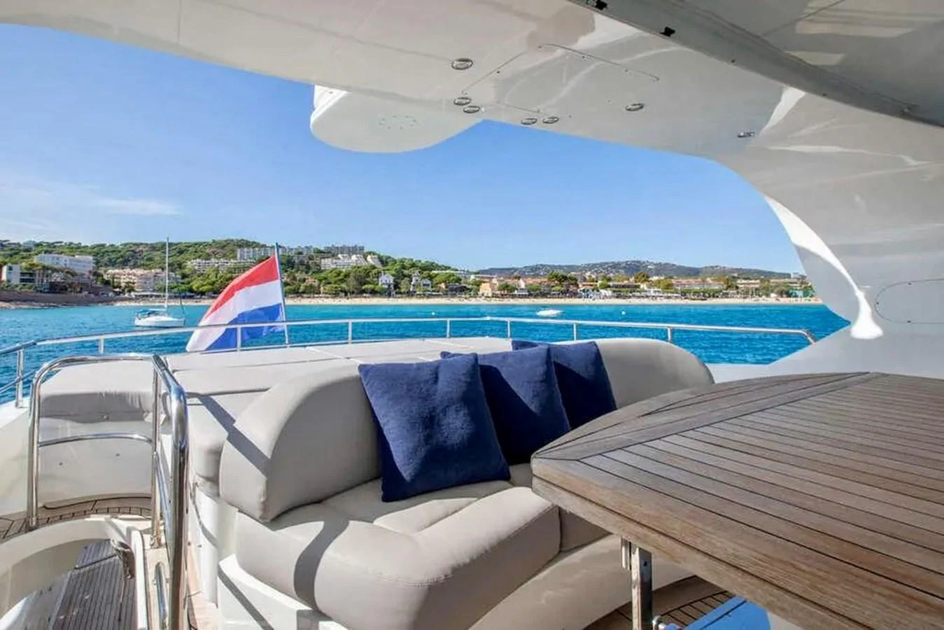 The aft deck offers a comfortable seating area with a stunning view of the water. aboard BALANDRAU Yacht for Sale