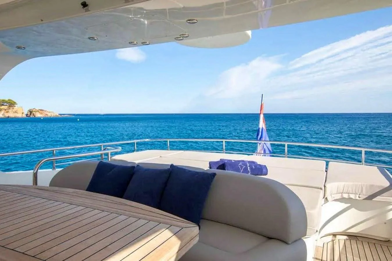 The aft deck offers a relaxing space with comfortable seating and stunning ocean views. aboard BALANDRAU Yacht for Sale