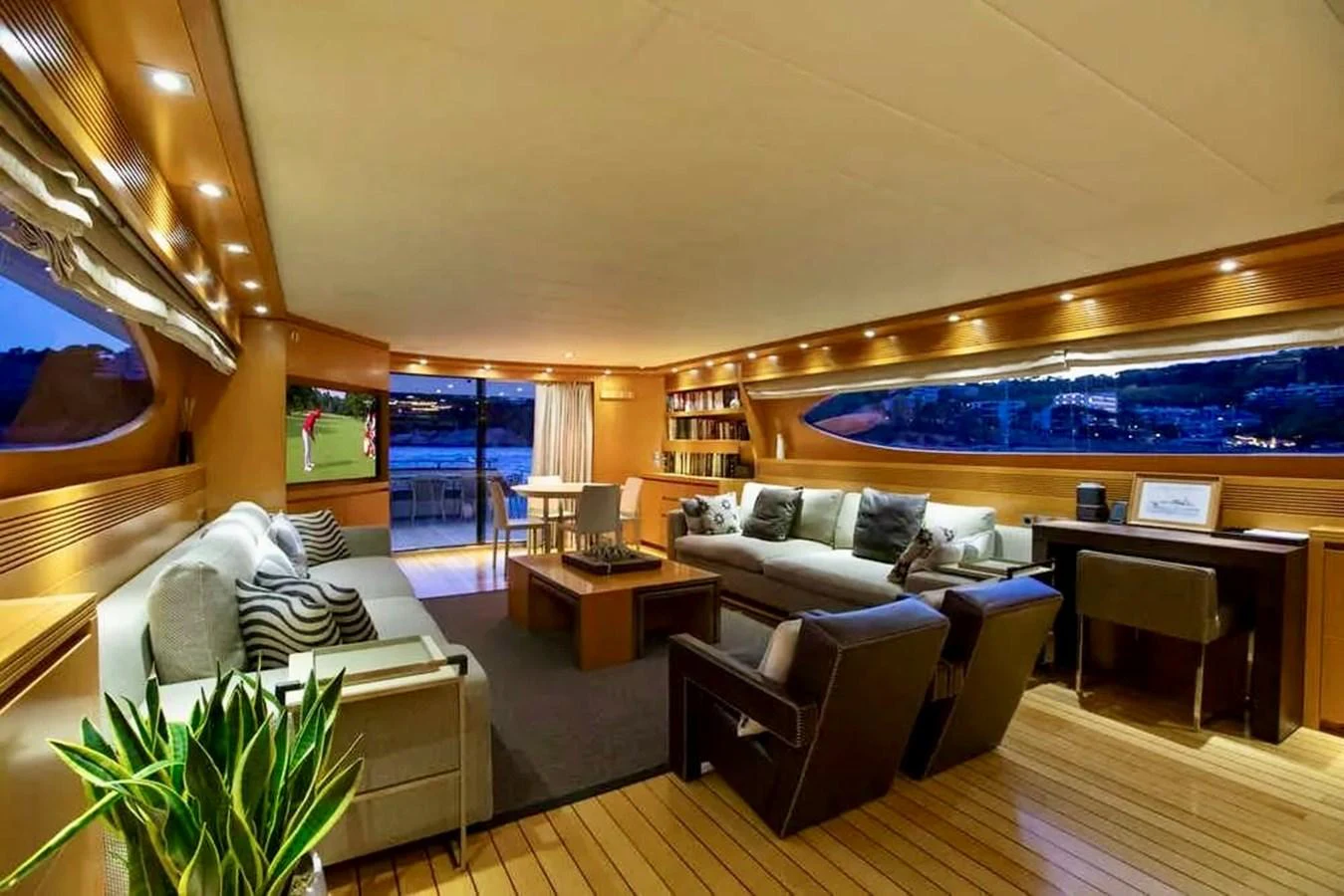 The spacious salon features comfortable seating and elegant lighting, perfect for relaxation and entertainment. aboard BALANDRAU Yacht for Sale