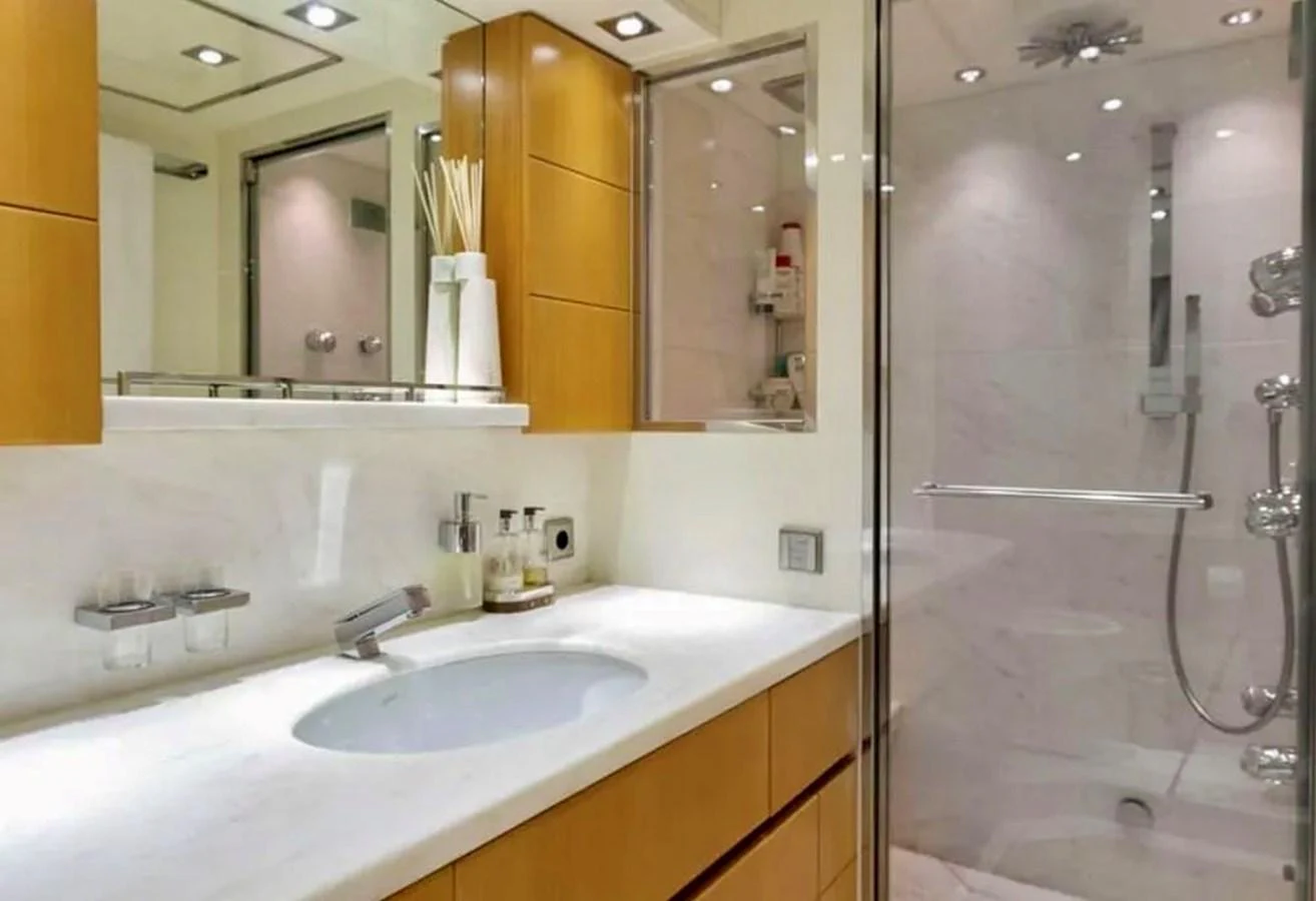 The yacht's bathroom features modern fixtures and a spacious shower area. aboard BALANDRAU Yacht for Sale
