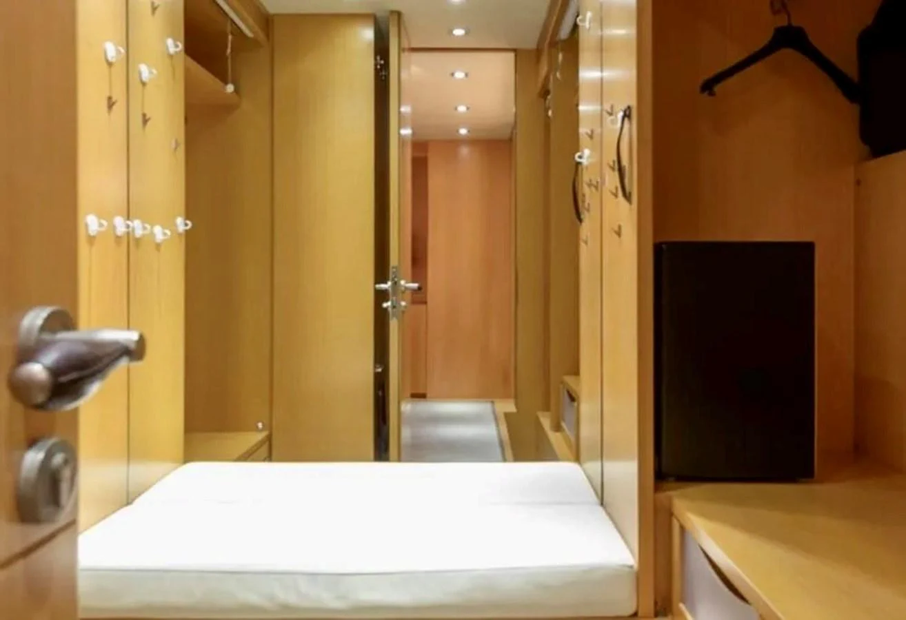 A cozy cabin area with ample storage space and a comfortable bed. aboard BALANDRAU Yacht for Sale