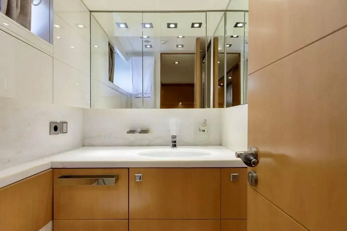 The yacht's bathroom features modern fixtures and a sleek design with ample mirror space. aboard BALANDRAU Yacht for Sale