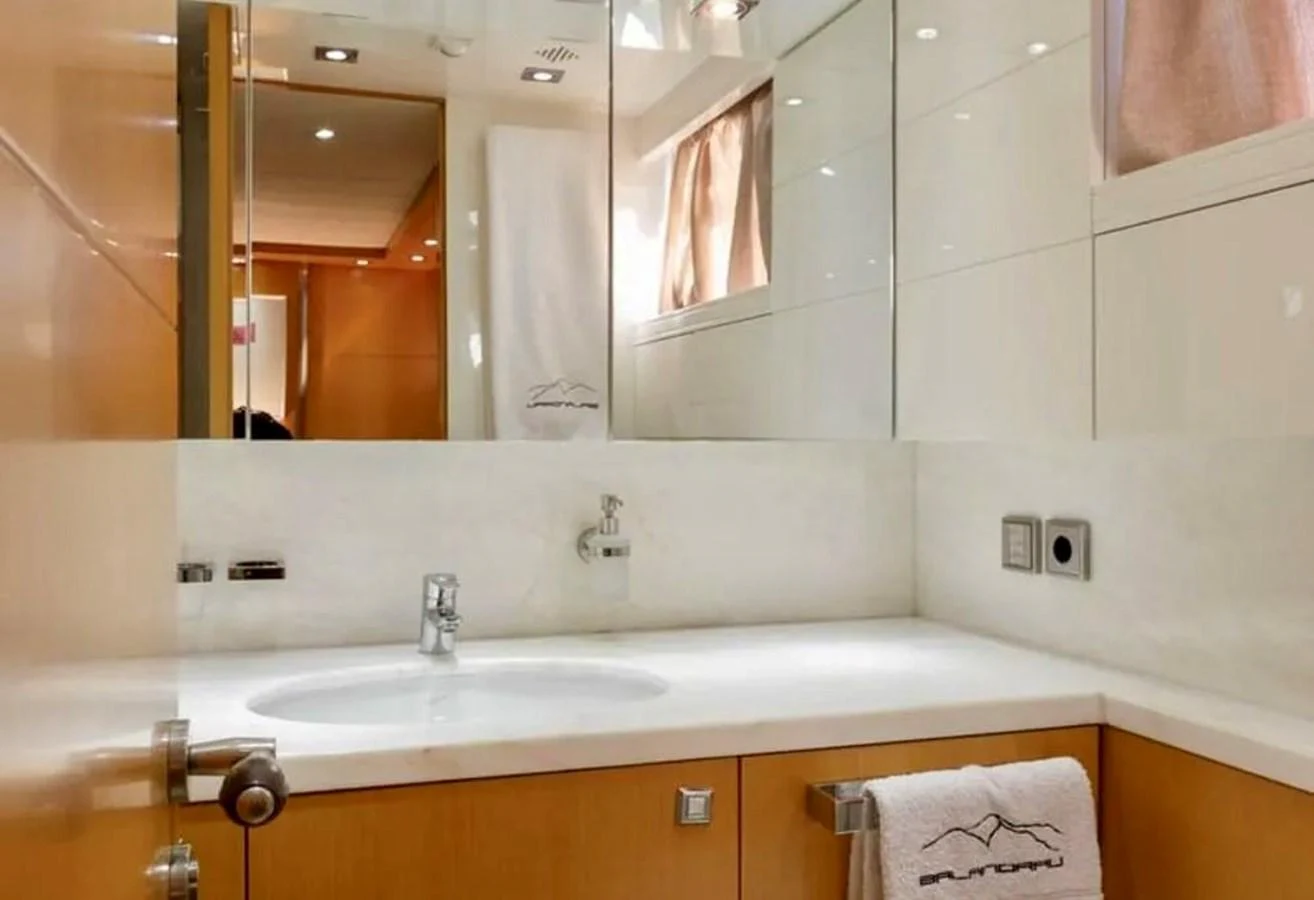 The yacht's bathroom features a sleek and modern design with ample lighting and high-quality fixtures. aboard BALANDRAU Yacht for Sale