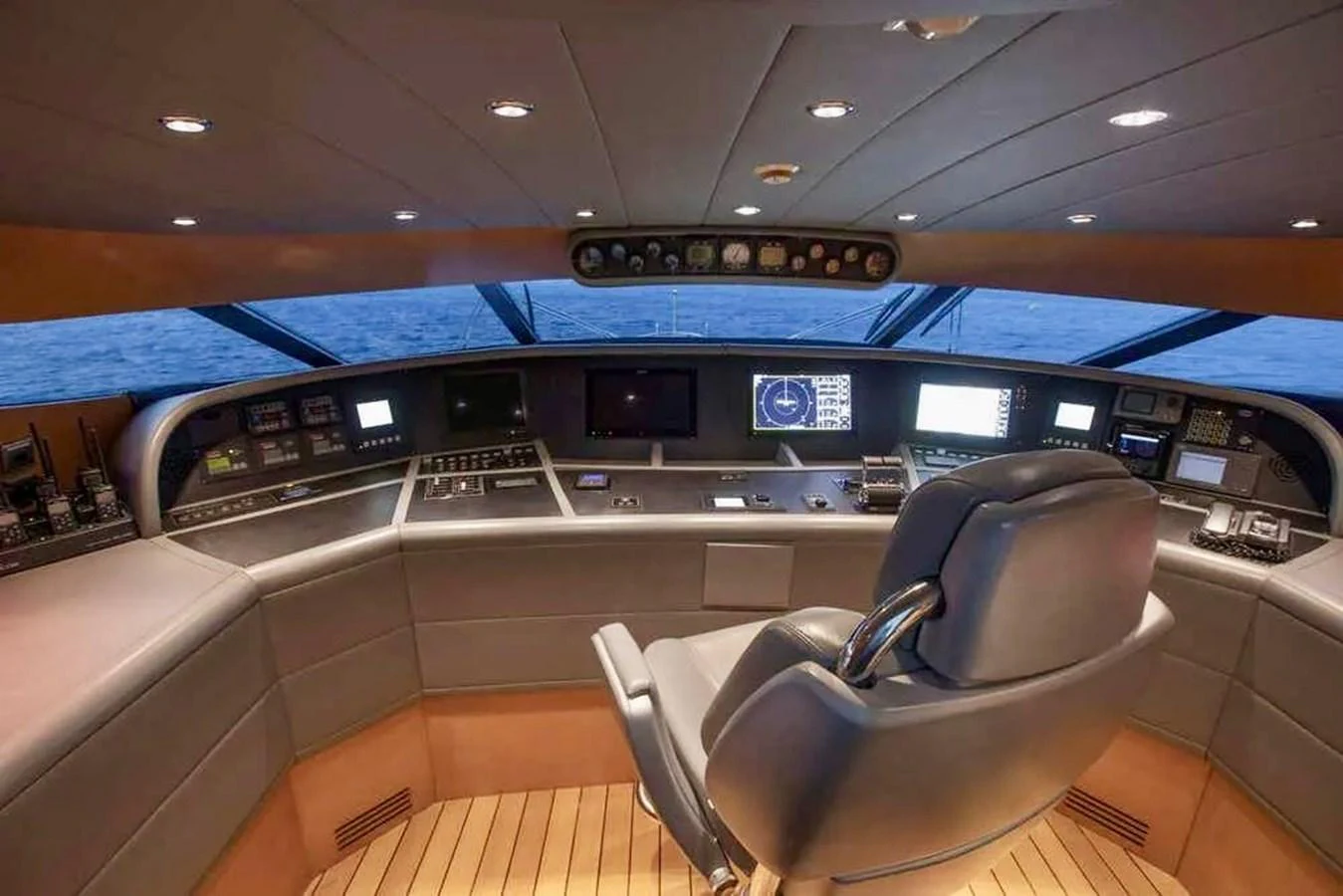The helm of this yacht features advanced navigation equipment and a comfortable captain's chair, offering a commanding view of the sea. aboard BALANDRAU Yacht for Sale