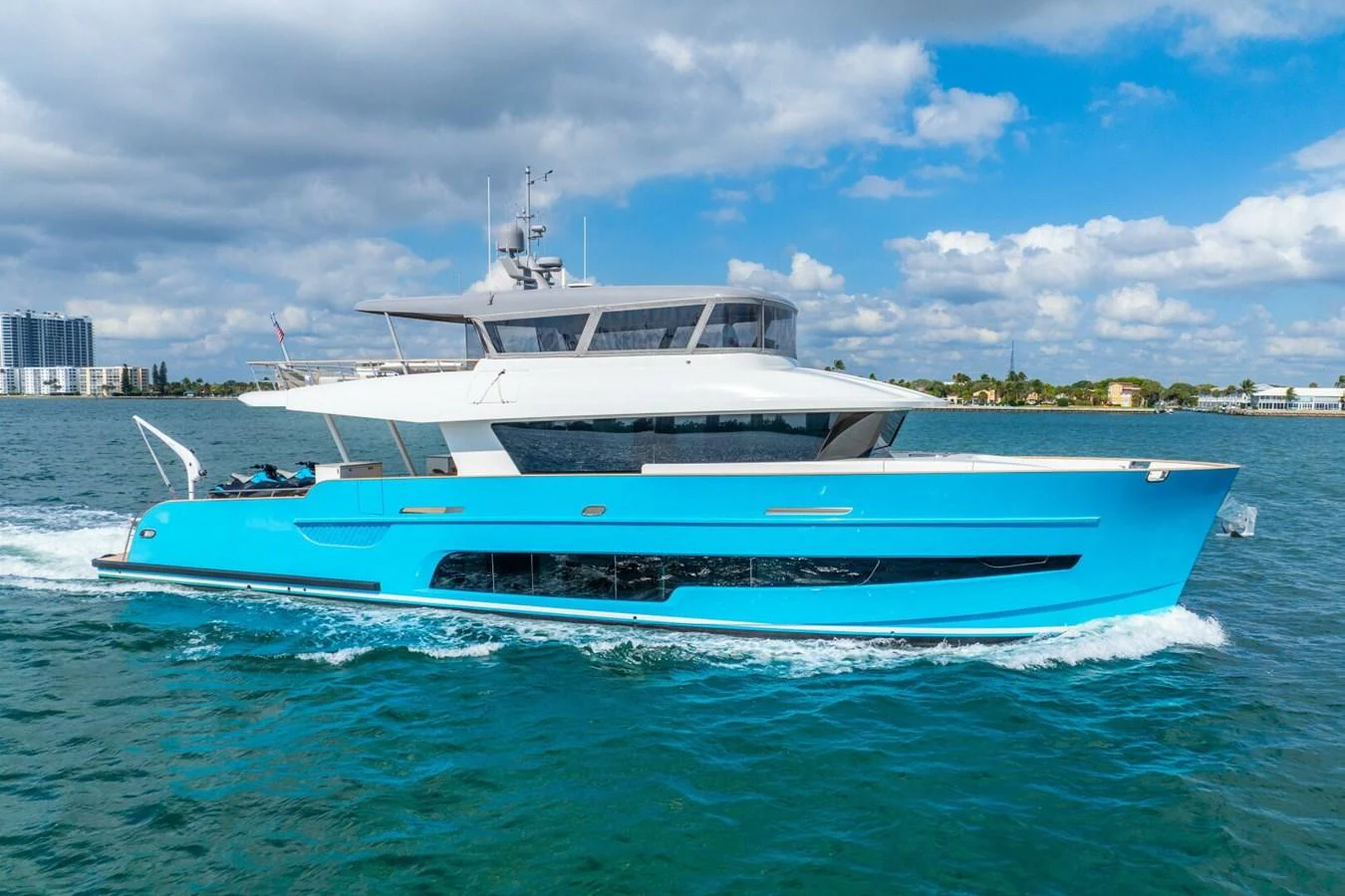 A sleek yacht cruises through the water under a bright blue sky. aboard LADY SADIE Yacht for Sale