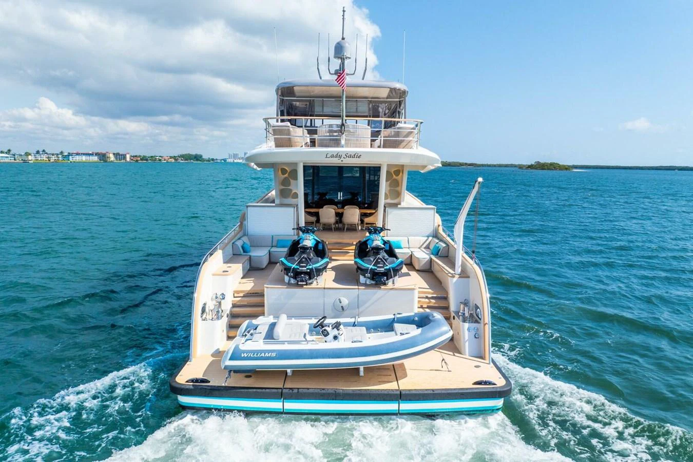 The yacht's aft deck features water toys and a tender, ready for adventure on the open sea. aboard LADY SADIE Yacht for Sale