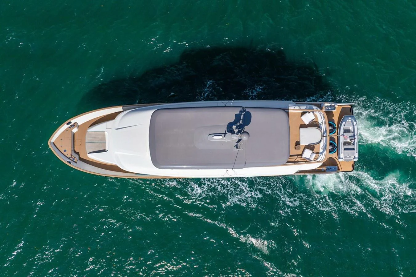 A sleek yacht cruises through the water, showcasing its streamlined design from an aerial perspective. aboard LADY SADIE Yacht for Sale
