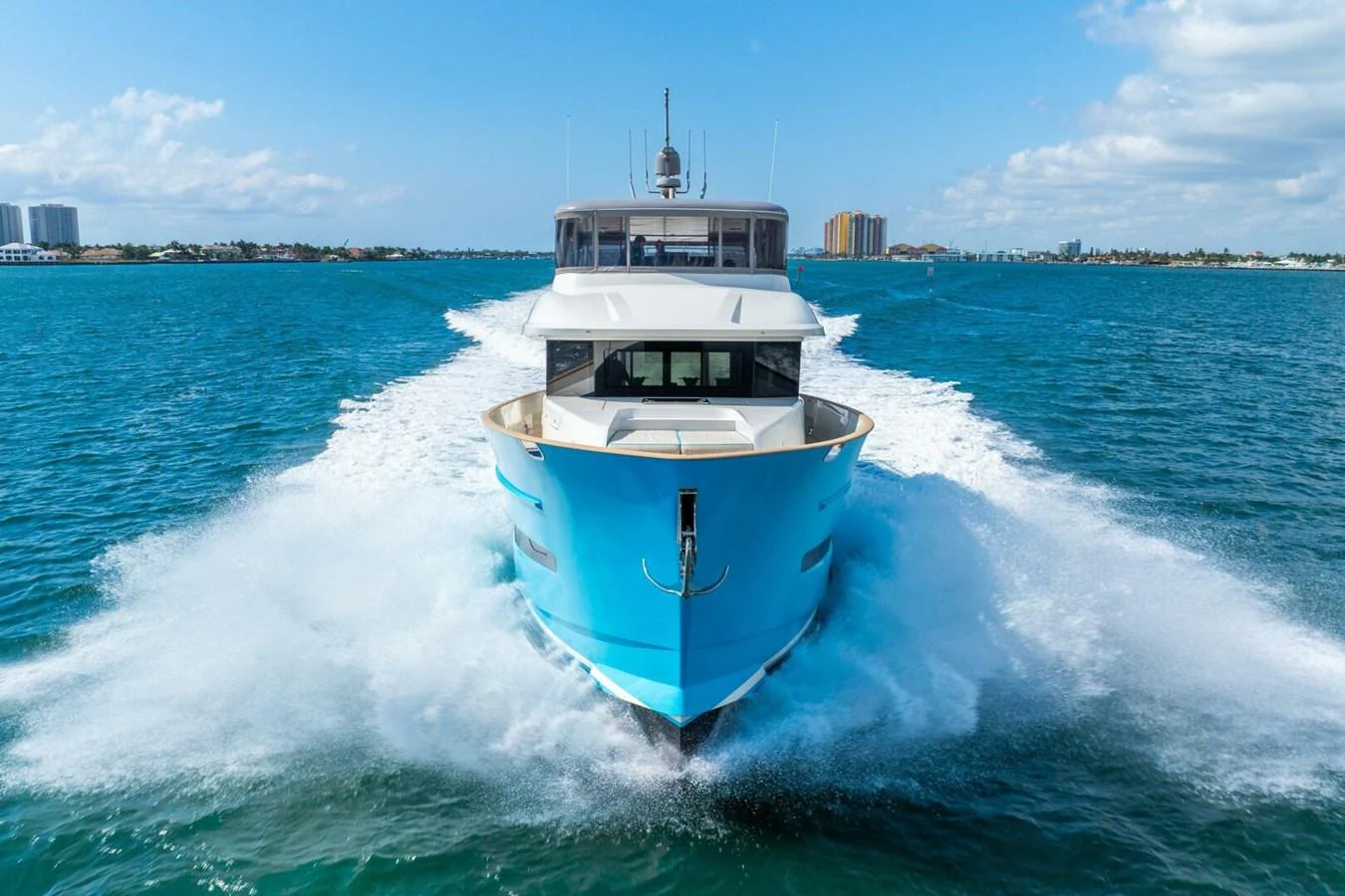 A sleek yacht cruises through the water, showcasing its impressive bow and modern design. aboard LADY SADIE Yacht for Sale