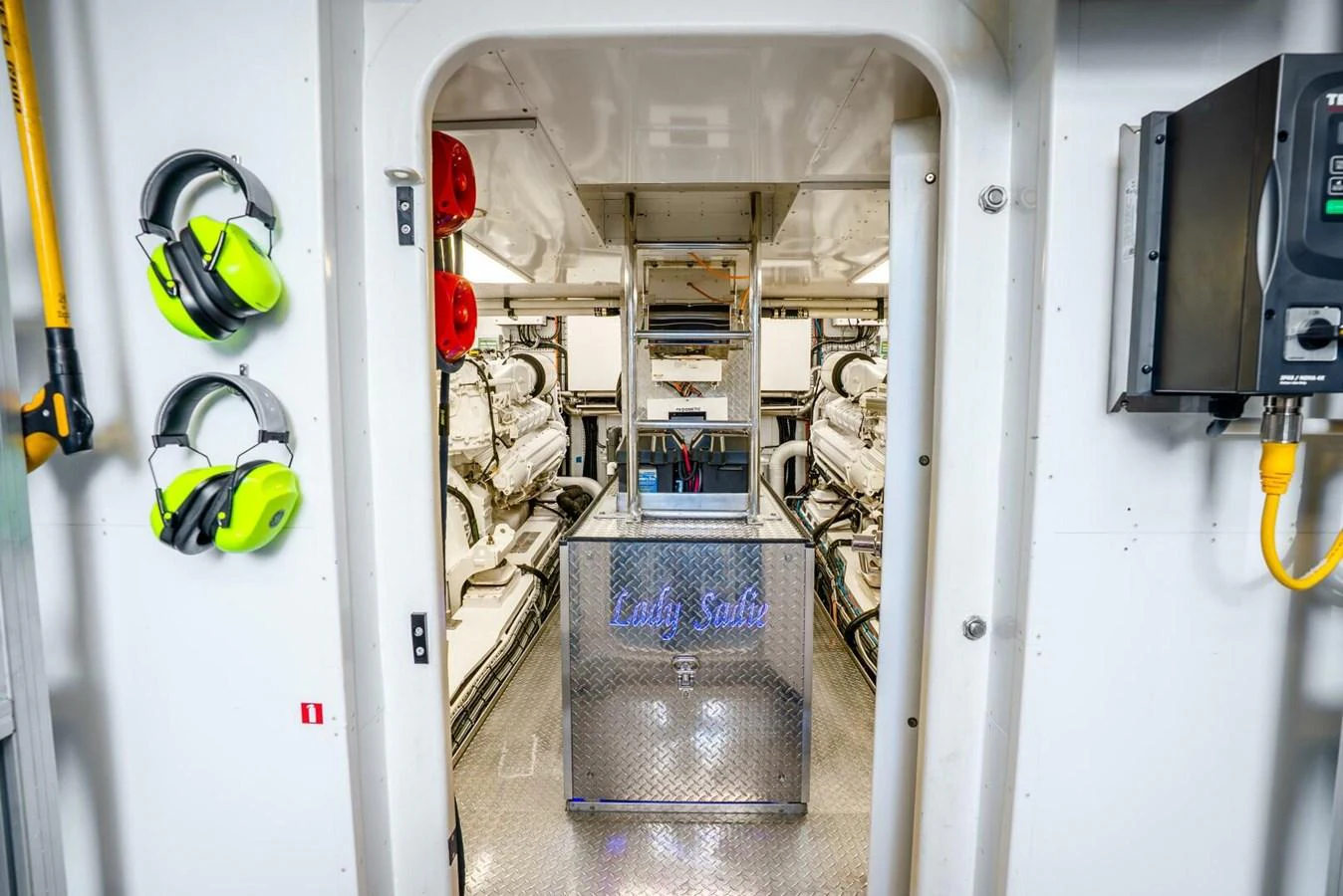 The engine room showcases powerful machinery and organized equipment for optimal performance. aboard LADY SADIE Yacht for Sale