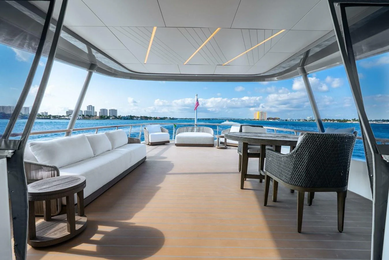 The aft deck offers a spacious and luxurious outdoor seating area with stunning views of the water. aboard LADY SADIE Yacht for Sale