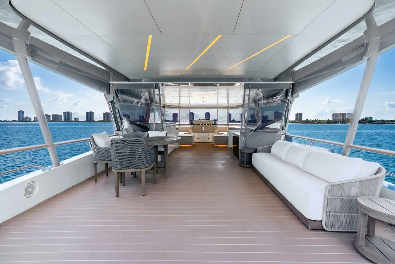 The aft deck features comfortable seating and dining areas with panoramic views. aboard LADY SADIE Yacht for Sale