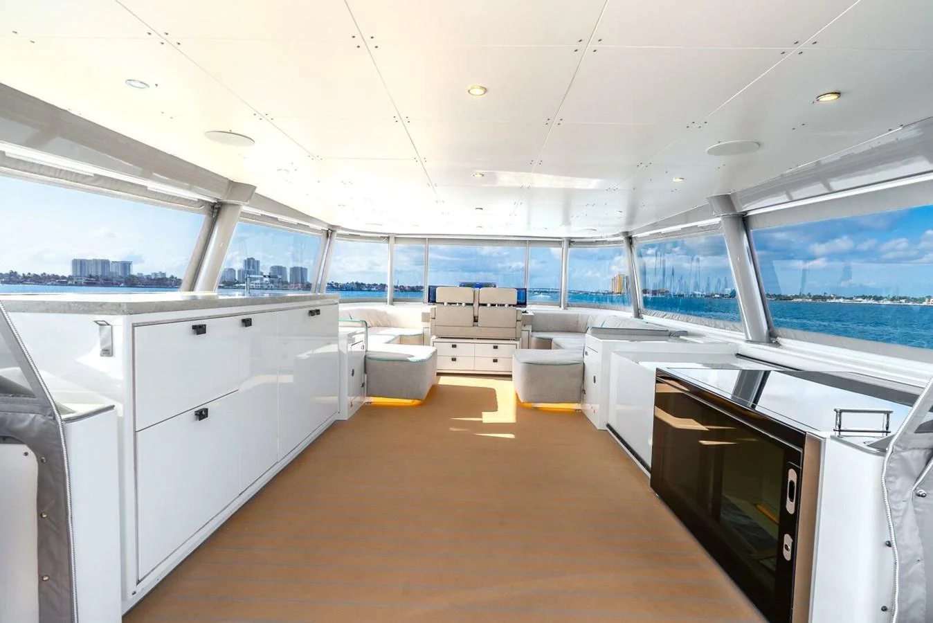 The spacious salon offers panoramic views and modern furnishings. aboard LADY SADIE Yacht for Sale