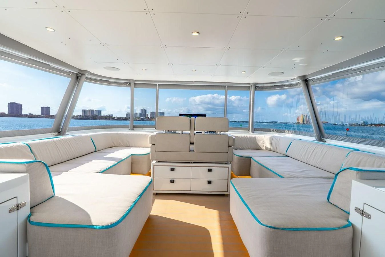 The salon offers a spacious and comfortable seating area with panoramic views. aboard LADY SADIE Yacht for Sale