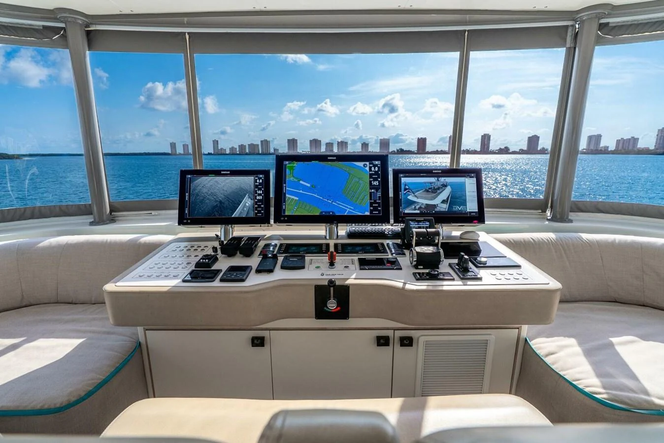 The helm features advanced navigation systems with panoramic views of the water and city skyline. aboard LADY SADIE Yacht for Sale