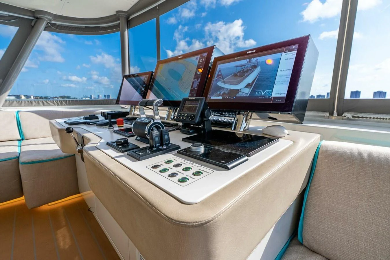 The helm station features advanced navigation equipment and comfortable seating. aboard LADY SADIE Yacht for Sale