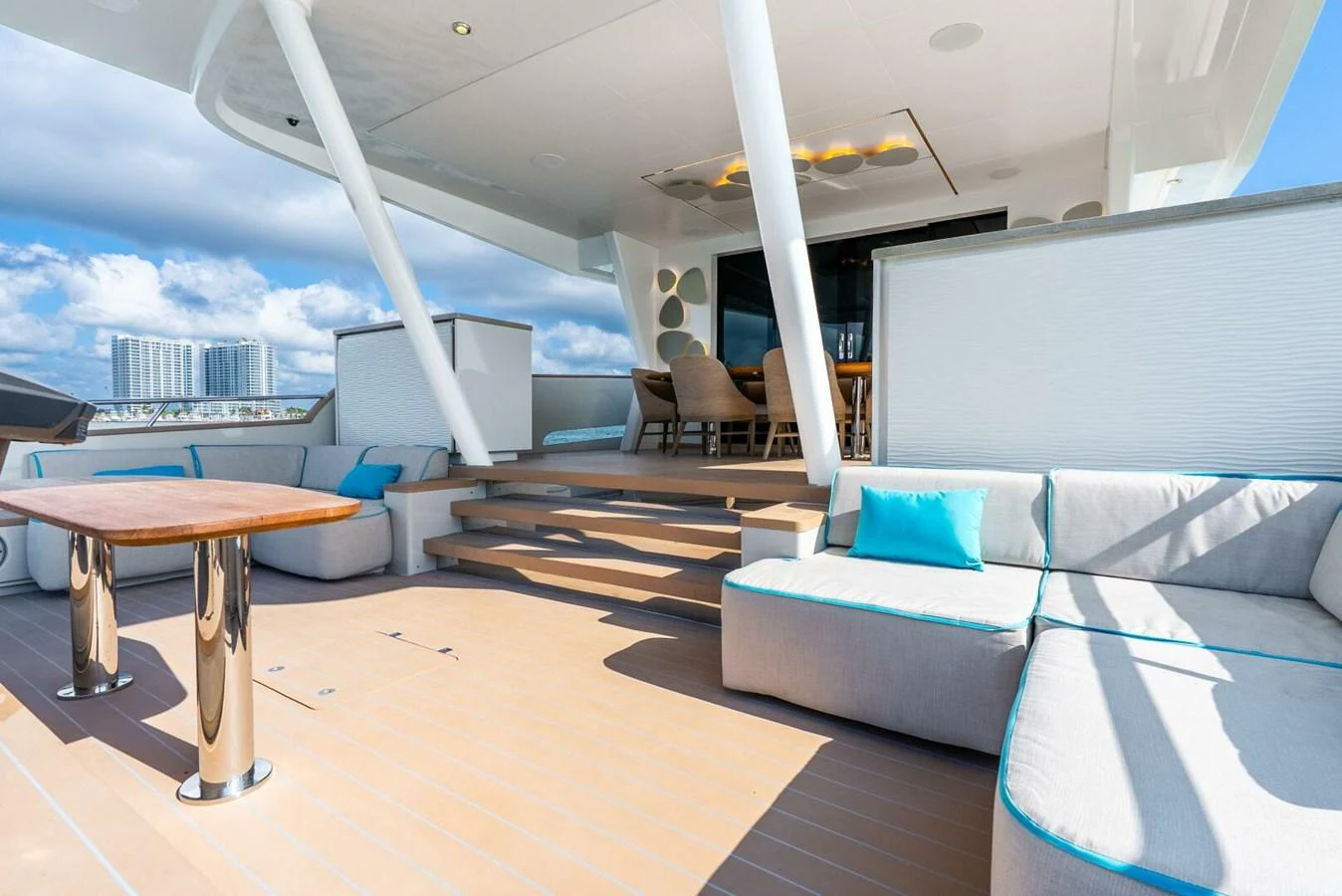 The aft deck features comfortable seating and a dining area, perfect for relaxation and socializing. aboard LADY SADIE Yacht for Sale