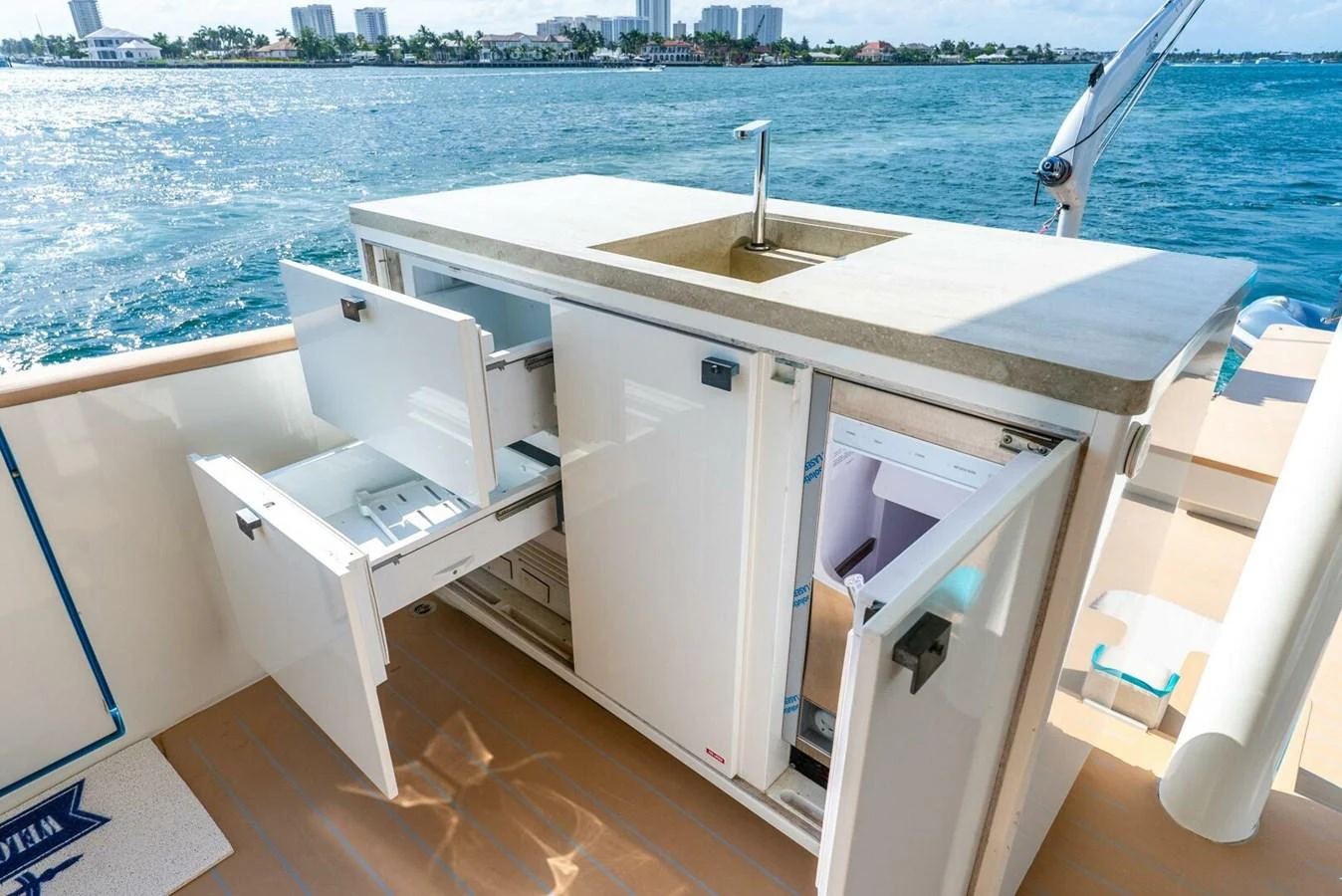 The yacht features a well-equipped outdoor galley with ample storage and a sink. aboard LADY SADIE Yacht for Sale