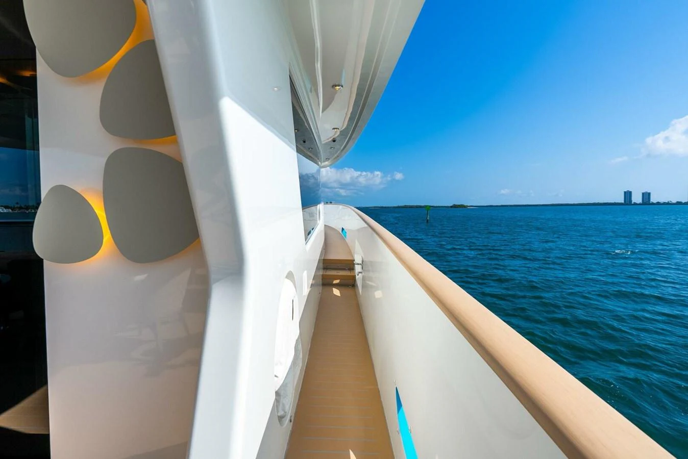 A sleek yacht exterior showcasing the side deck with a view of the open water. aboard LADY SADIE Yacht for Sale