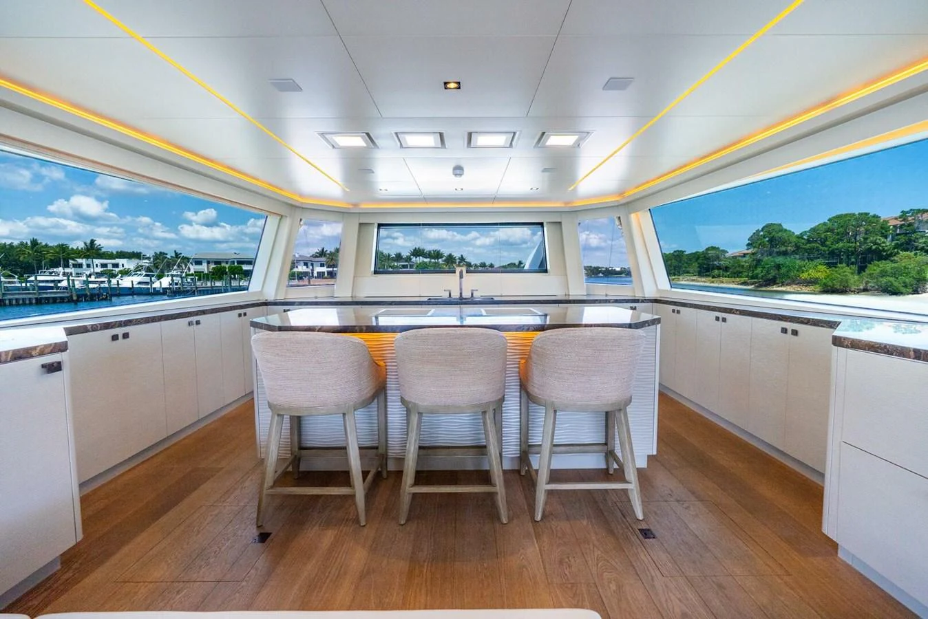 The yacht's galley features a spacious and modern design with ample seating and panoramic windows. aboard LADY SADIE Yacht for Sale