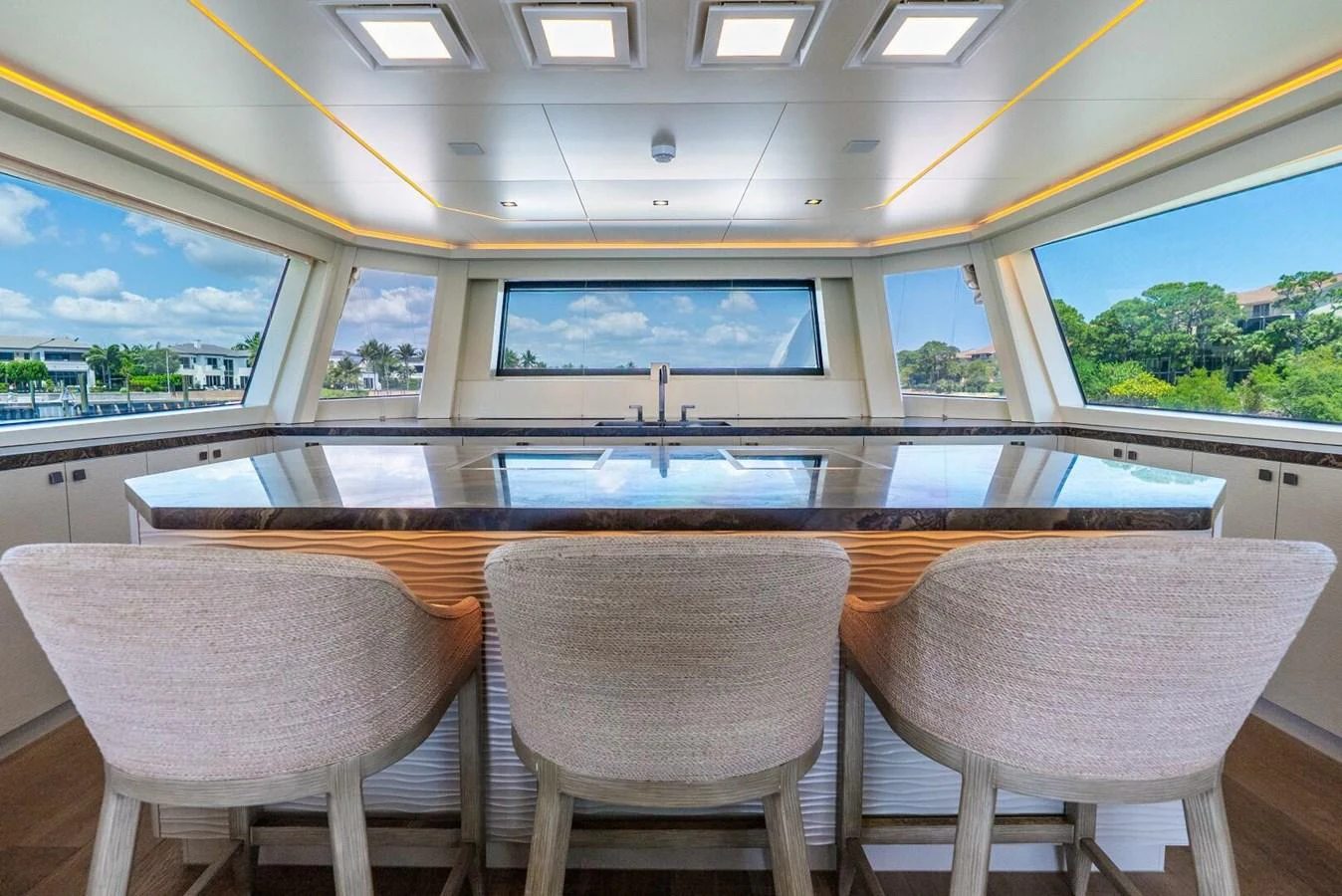 A luxurious dining area with panoramic windows offering stunning views. aboard LADY SADIE Yacht for Sale