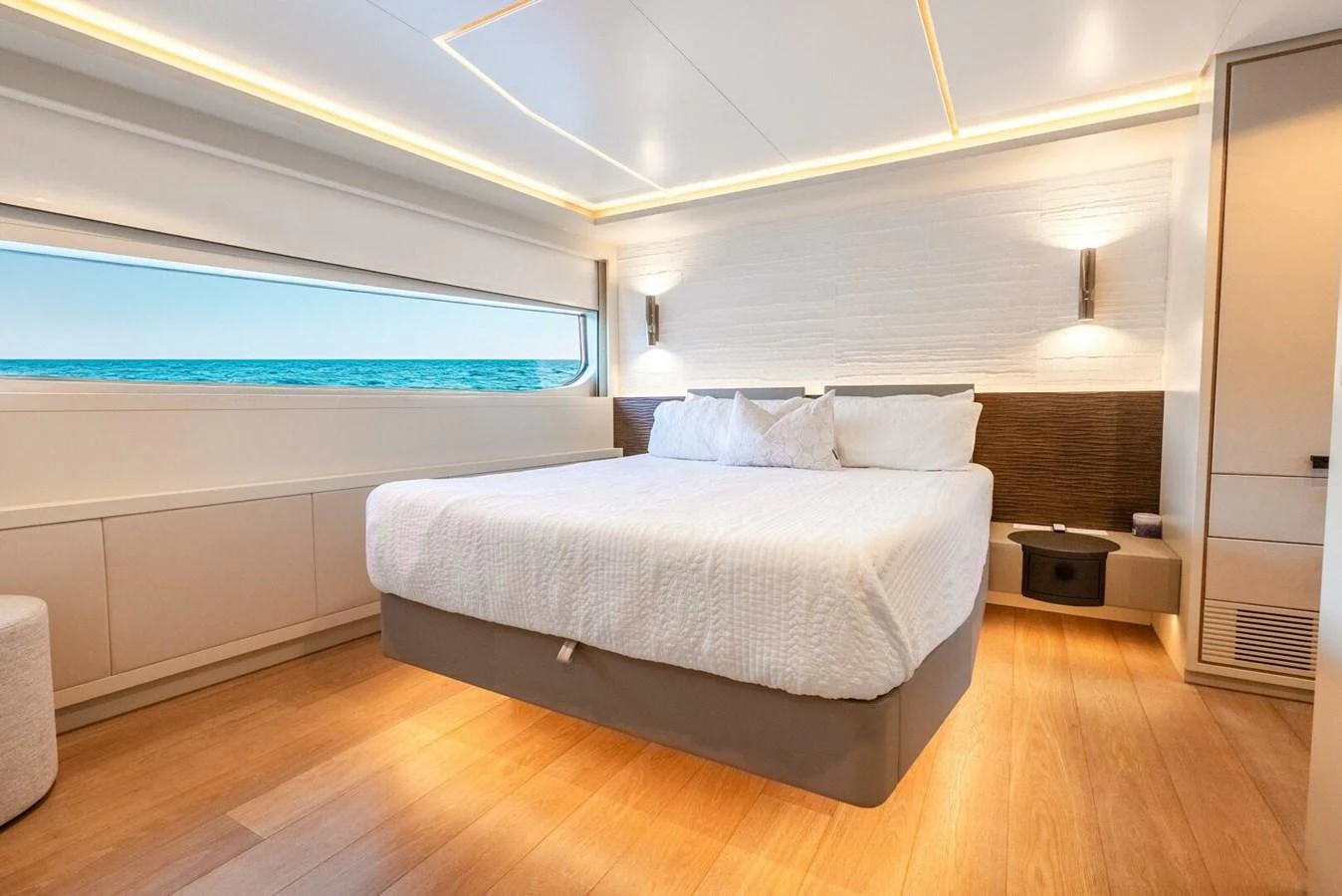 A luxurious stateroom with a large bed and ocean view. aboard LADY SADIE Yacht for Sale