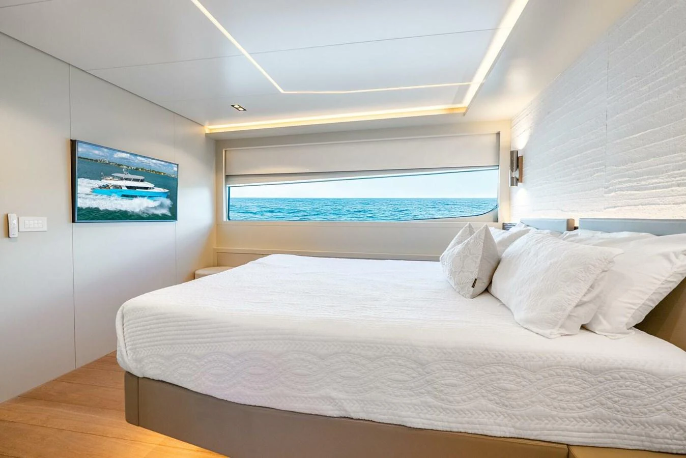 A luxurious stateroom with a large bed and a scenic ocean view. aboard LADY SADIE Yacht for Sale