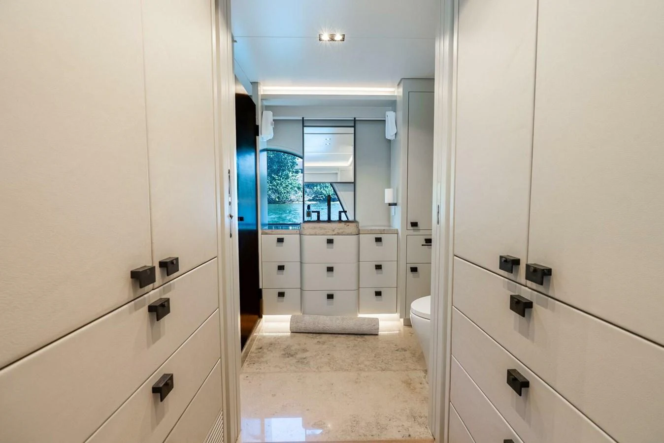 The yacht's bathroom features modern cabinetry and a sleek design. aboard LADY SADIE Yacht for Sale