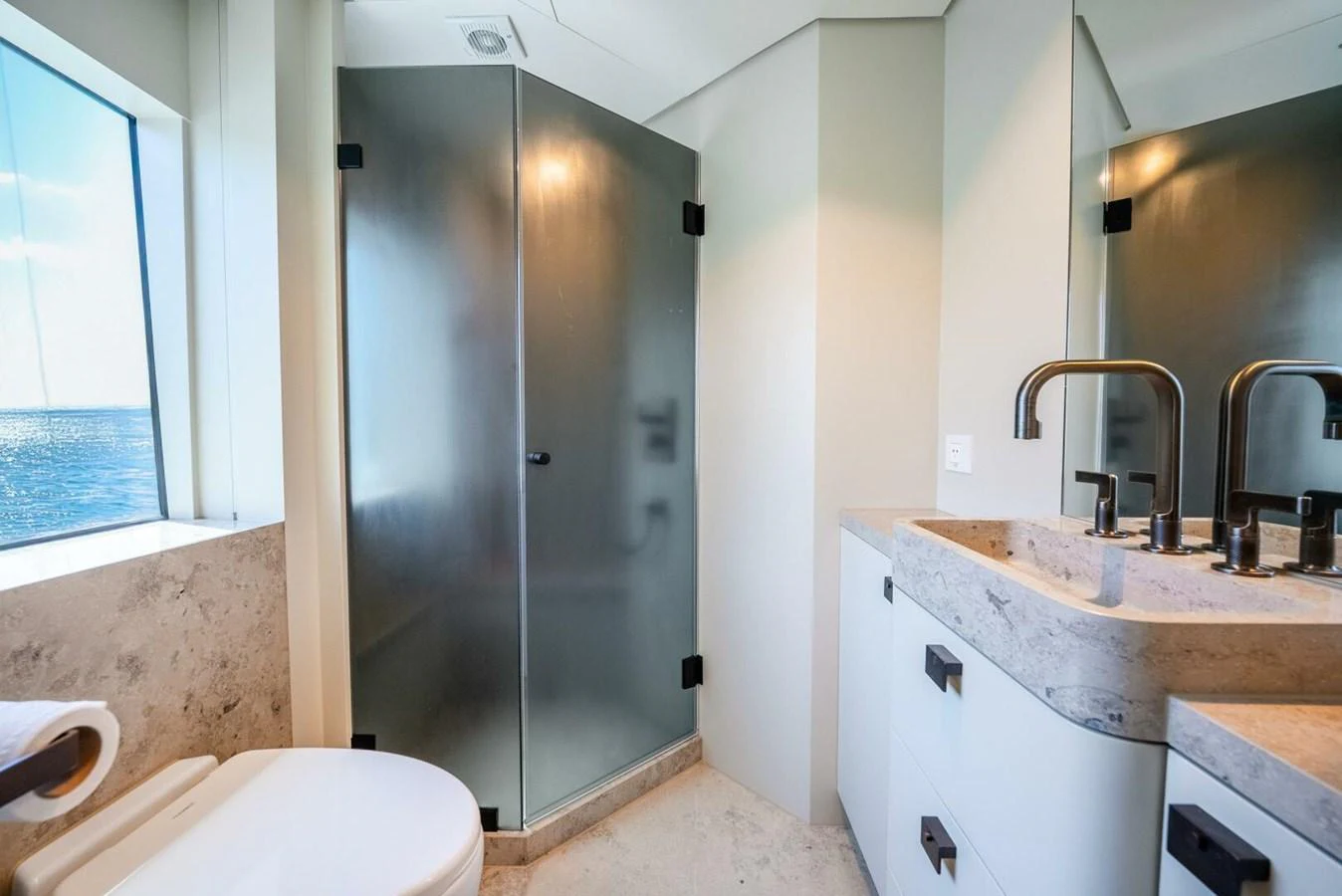 The yacht's bathroom features modern fixtures and a spacious shower area. aboard LADY SADIE Yacht for Sale