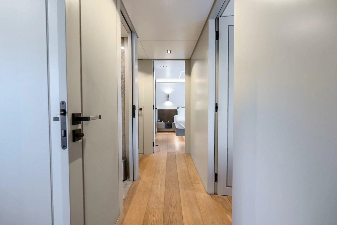 A sleek hallway leading to a well-lit stateroom. aboard LADY SADIE Yacht for Sale