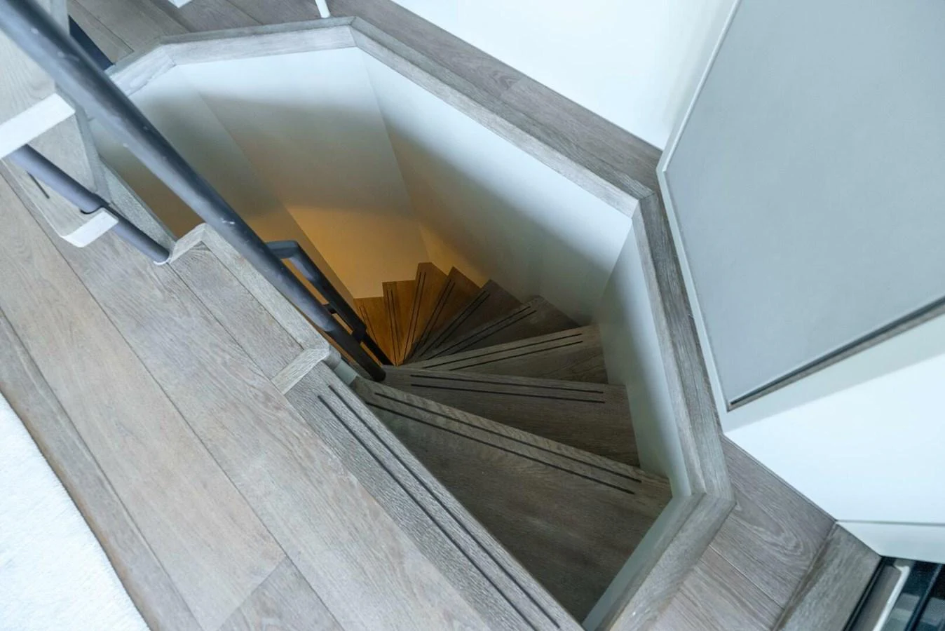 A modern wooden staircase leads to the lower deck of the yacht. aboard LADY SADIE Yacht for Sale