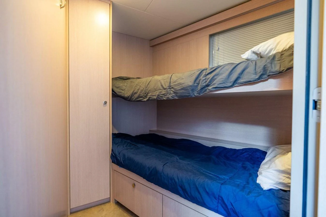 The guest cabin features cozy bunk beds with ample storage space. aboard LADY SADIE Yacht for Sale