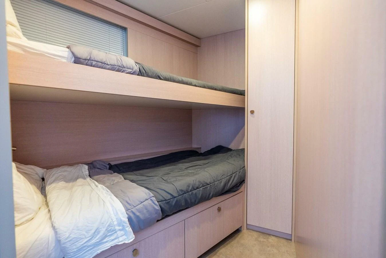 The guest cabin features cozy bunk beds and ample storage space. aboard LADY SADIE Yacht for Sale