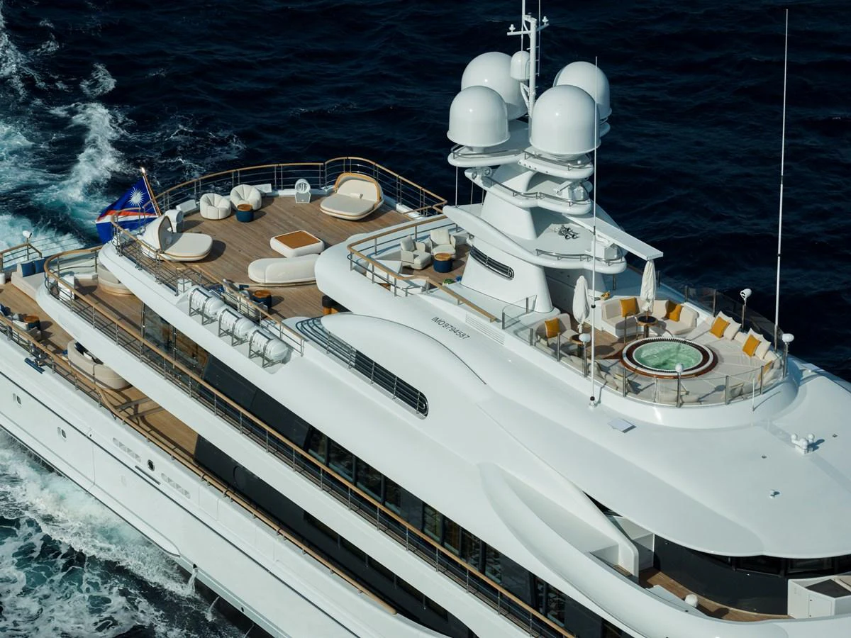 The yacht's sundeck features luxurious lounging areas and a jacuzzi, perfect for relaxation at sea. aboard SYNTHESIS Yacht for Sale