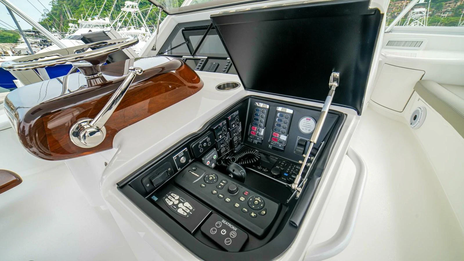 The yacht's helm features advanced navigation and control systems. aboard FREE SPOOL Yacht for Sale