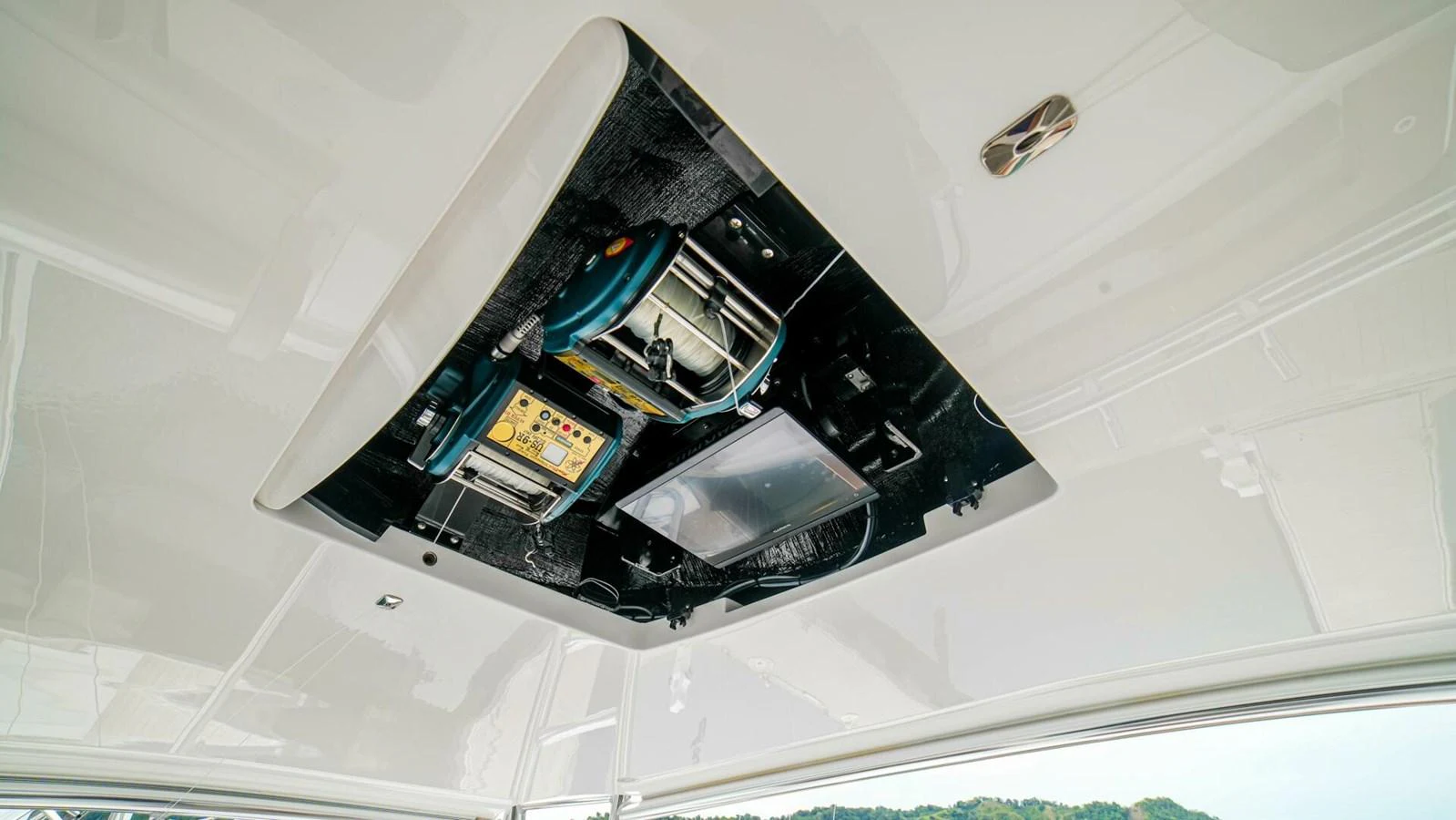 A close-up view of the yacht's ceiling-mounted equipment and control panel. aboard FREE SPOOL Yacht for Sale