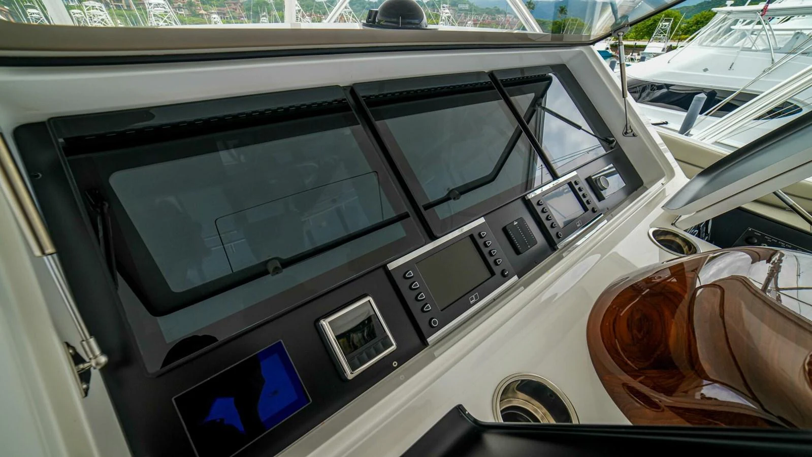 The helm station features advanced navigation equipment and a sleek design. aboard FREE SPOOL Yacht for Sale