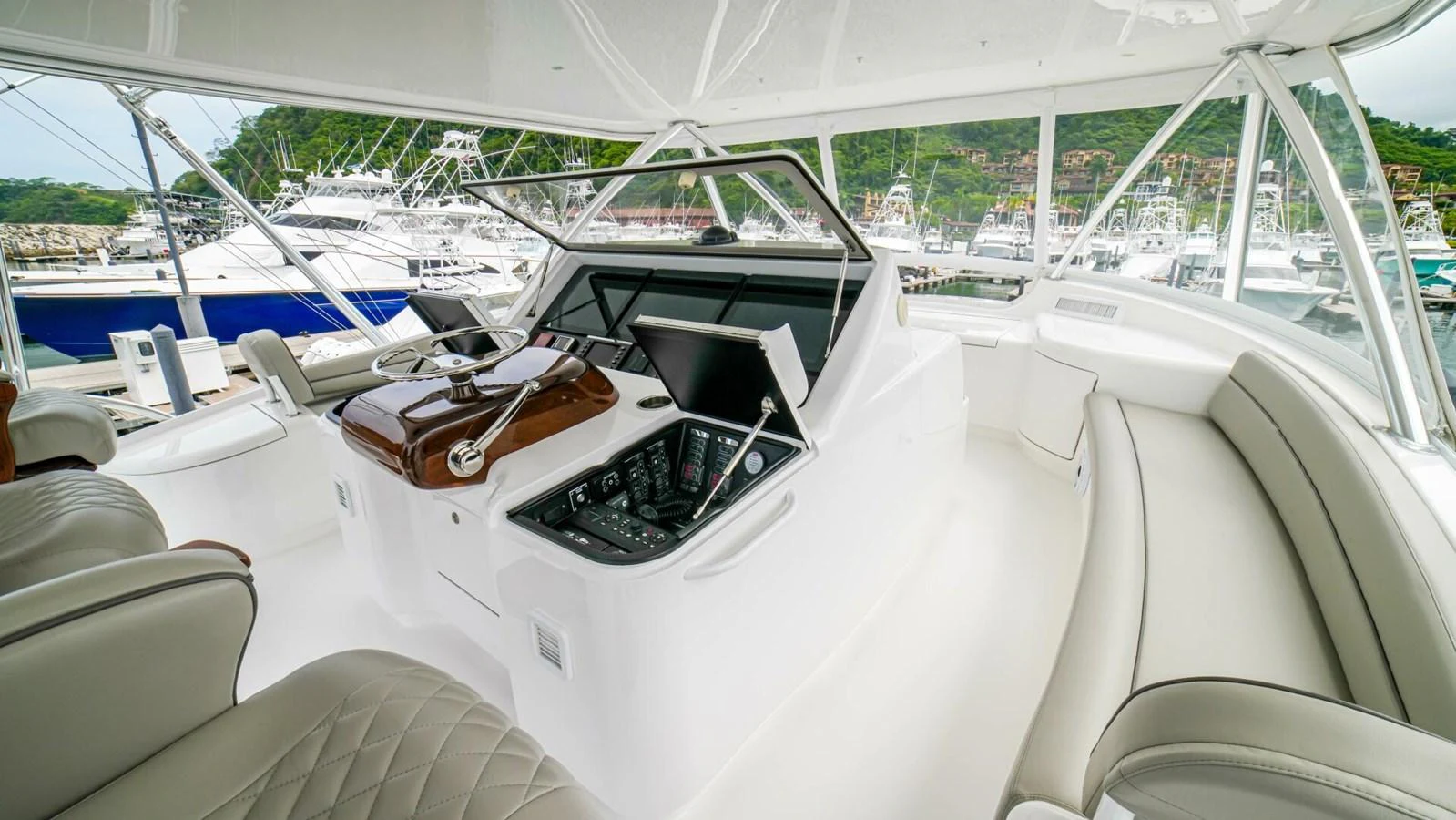 The helm area features modern navigation equipment and comfortable seating. aboard FREE SPOOL Yacht for Sale