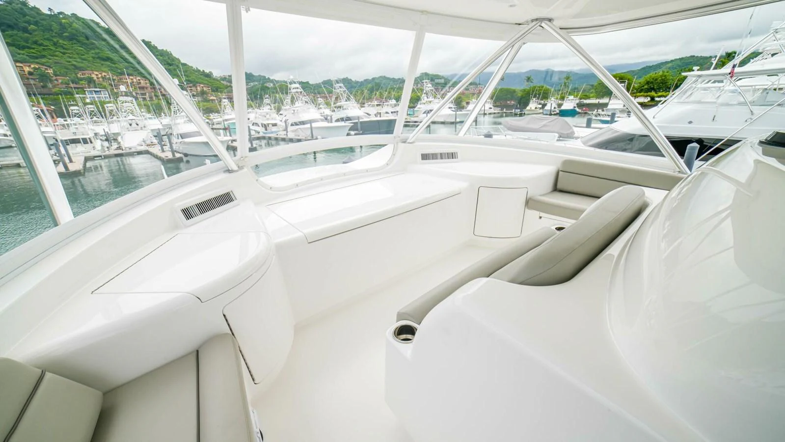 The helm area offers a sleek and modern design with comfortable seating and panoramic views. aboard FREE SPOOL Yacht for Sale