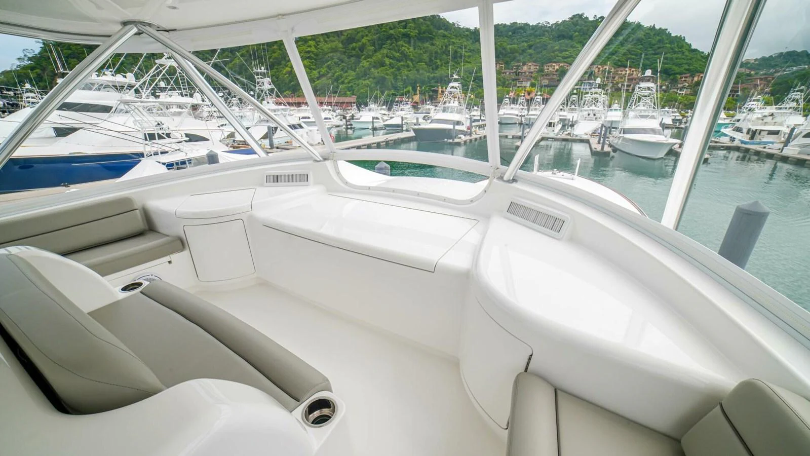 The helm area offers a spacious and comfortable seating arrangement with panoramic views of the marina. aboard FREE SPOOL Yacht for Sale
