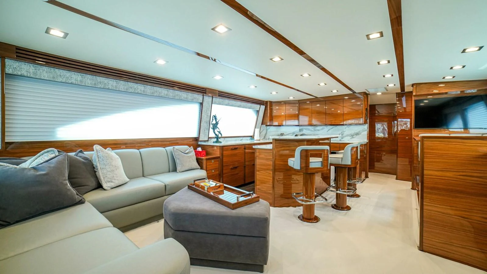 The yacht's salon features a spacious seating area with luxurious furnishings and modern decor. aboard FREE SPOOL Yacht for Sale