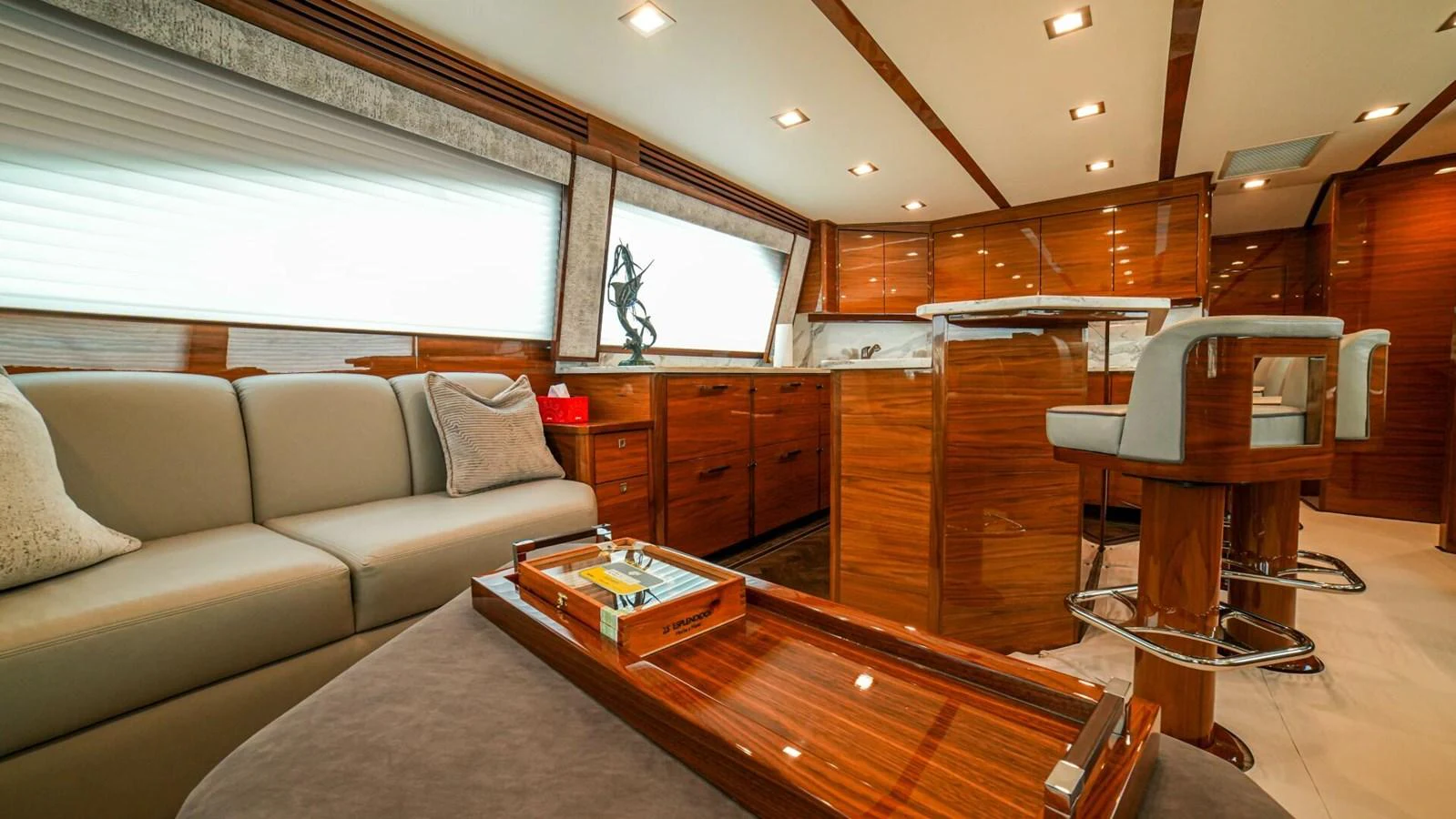 The yacht's interior features a stylish and comfortable lounge area with modern furnishings. aboard FREE SPOOL Yacht for Sale